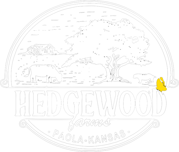 Hedgewood Farms logo featuring a pastoral scene with a barn, tree, and livestock, located in Paola, Kansas. The design emphasizes a rural lifestyle and farm identity.